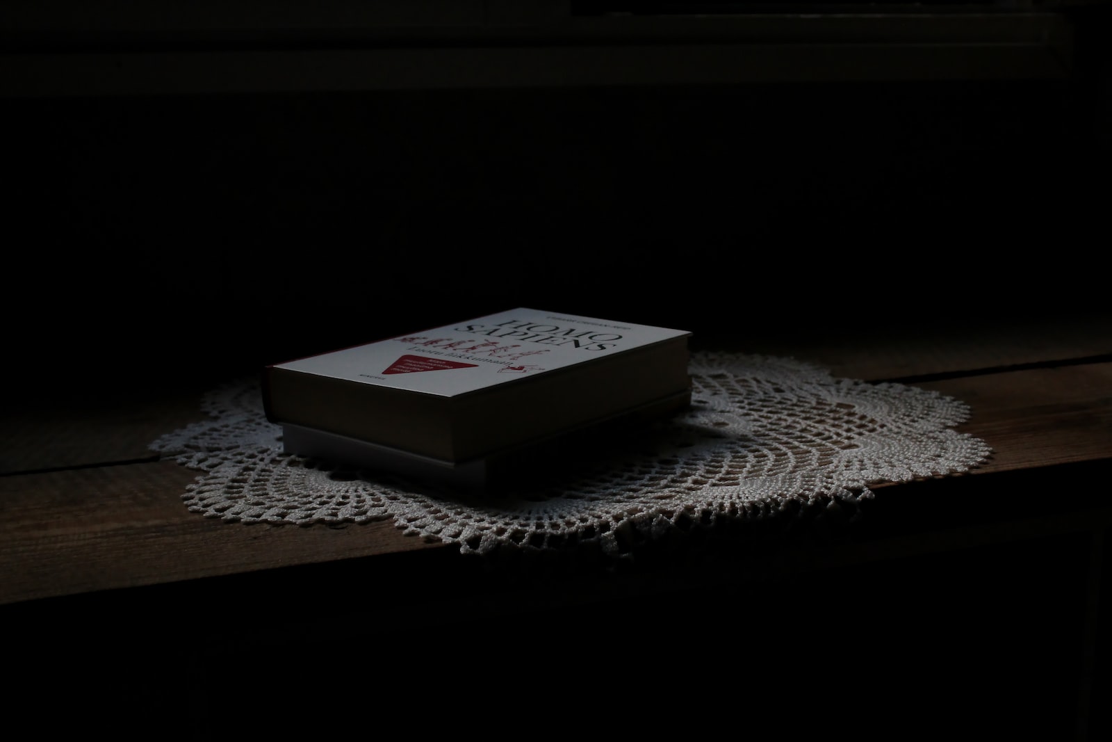 white and red marlboro cigarette pack on white table cloth