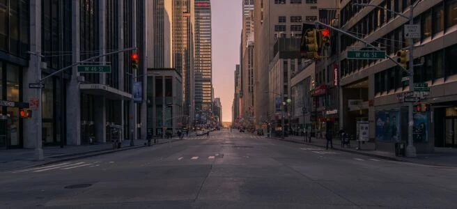 gray concrete road between buildings